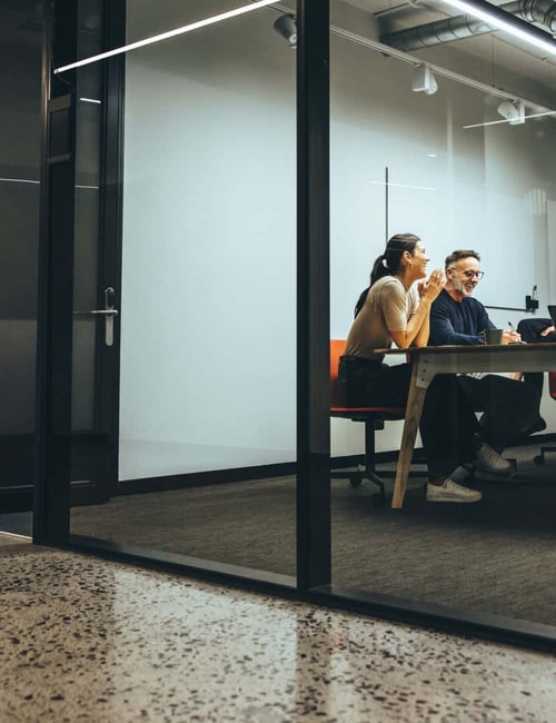 wide shot of a conference room full of people